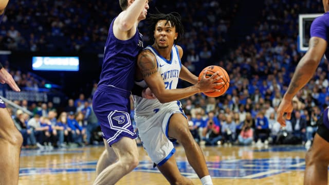 Nov 17, 2023; Lexington, Kentucky, USA; Kentucky Wildcats guard D.J. Wagner (21) drives to the basket during the second half against the Stonehill Skyhawks at Rupp Arena at Central Bank Center. Mandatory Credit: Jordan Prather-USA TODAY Sports